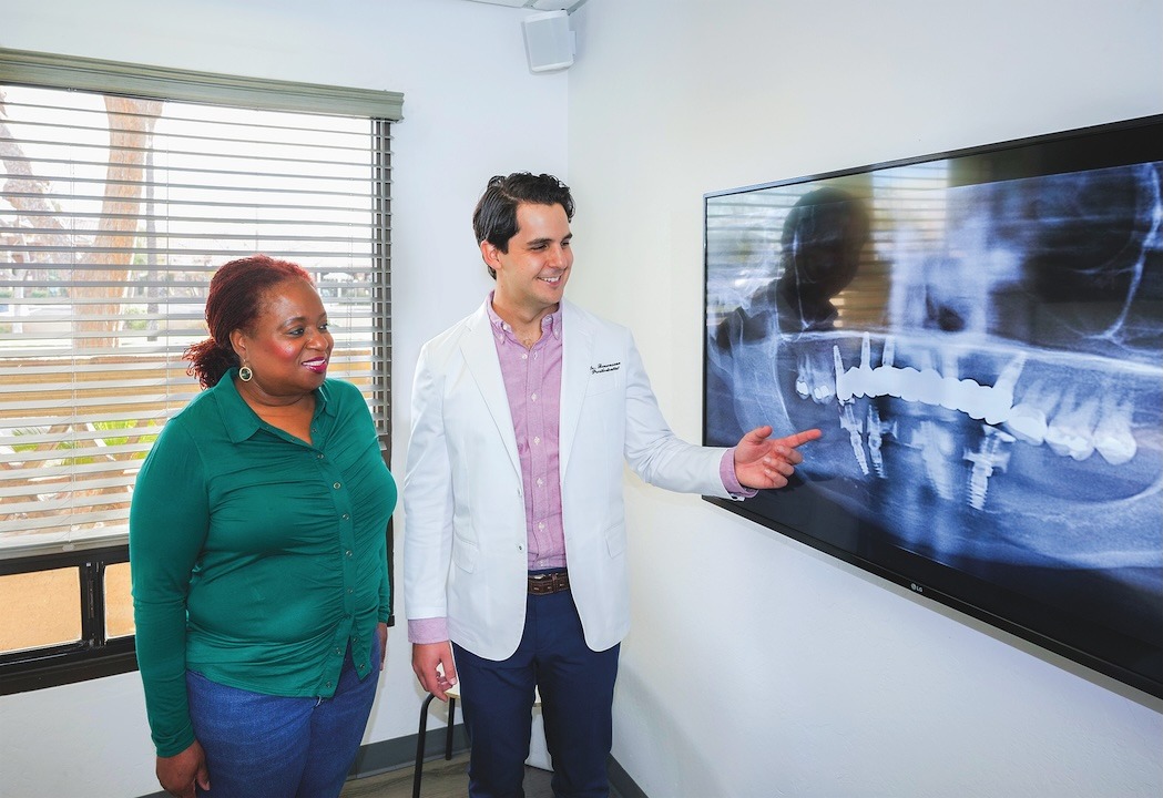 Dr. Bensoussan going over dental implant complications solutions.